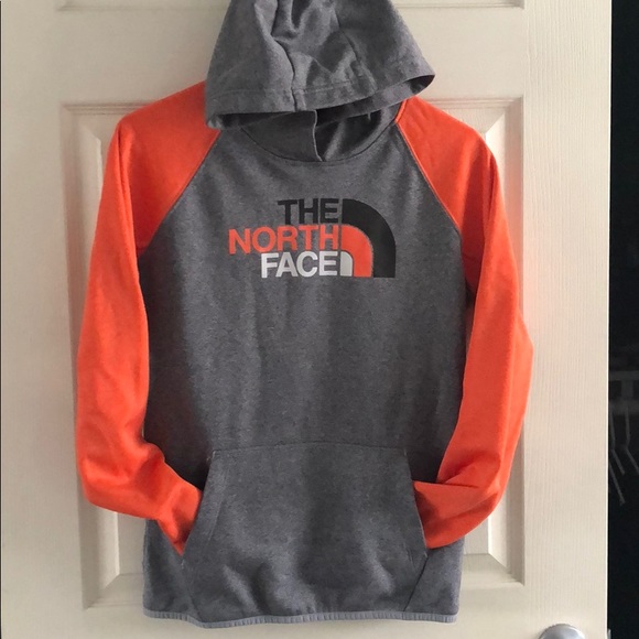 orange north face jumper
